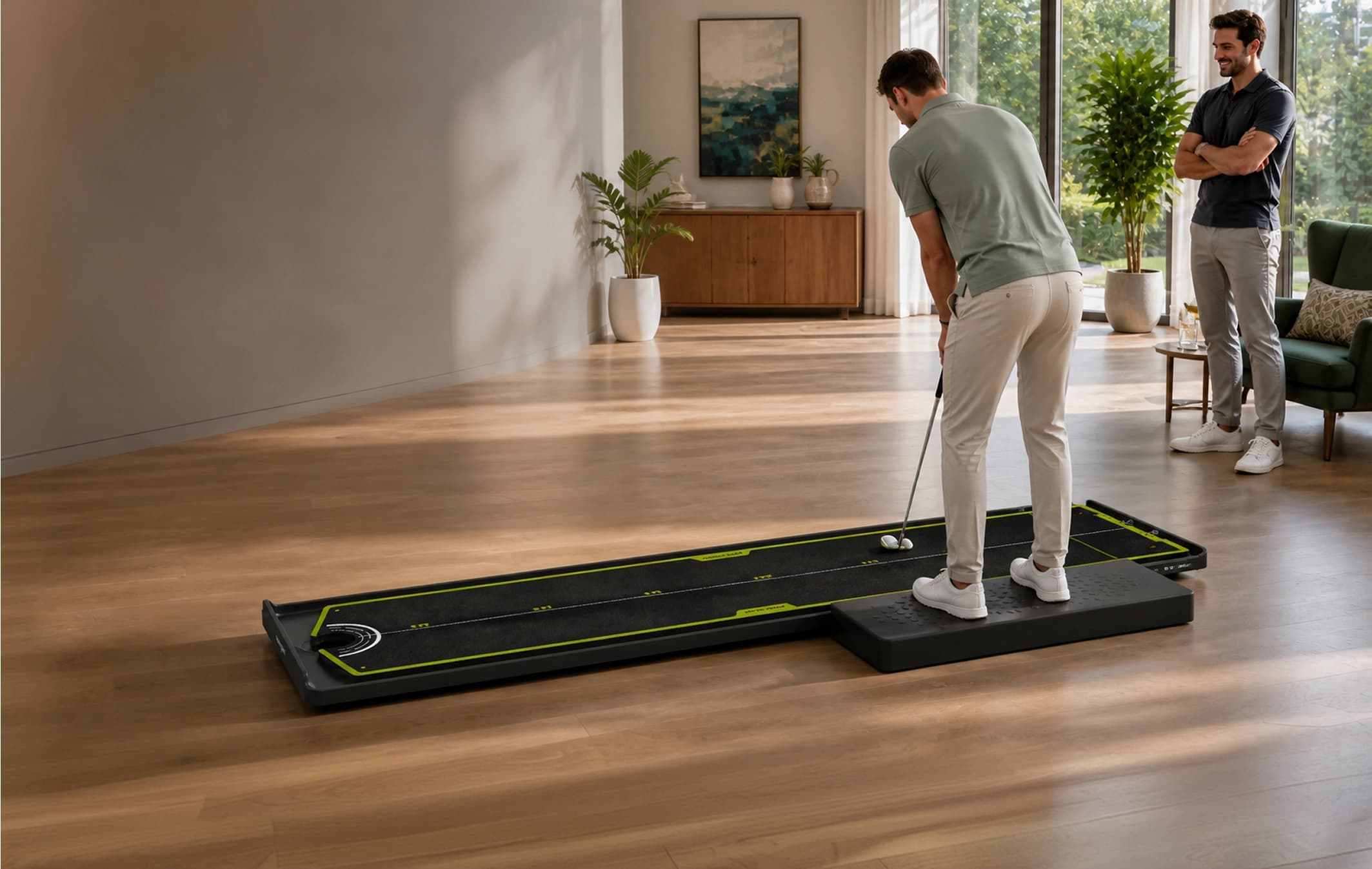 Two friends enjoying a full-length putting challenge with the active player viewed from behind on the side stance platform.